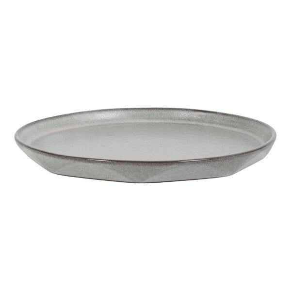 A round, shallow, gray plate with a slightly raised rim and a smooth finish.