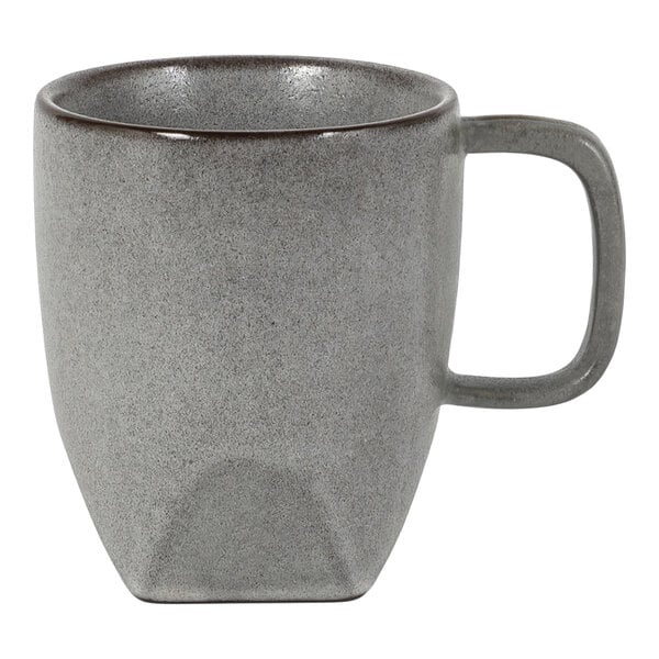 A gray, textured ceramic mug with a square-shaped handle and a slightly tapered base.