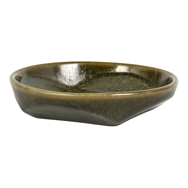 A small, shallow, round dish with a glossy, dark olive-green finish and slightly irregular edges.
