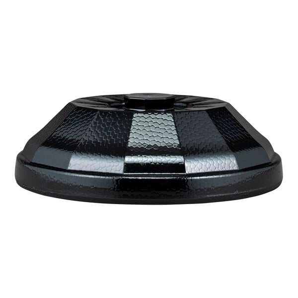 A black, textured, dome-shaped cover with a central knob, viewed from the side.