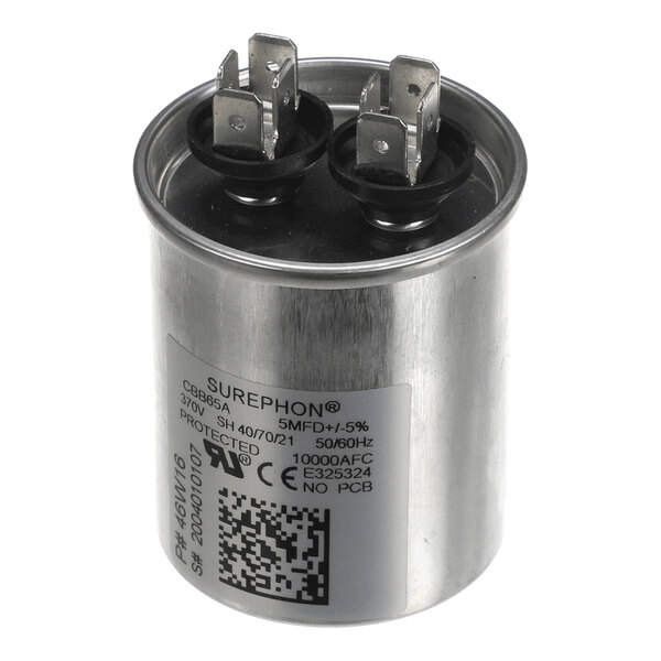 A cylindrical metal capacitor with two sets of electrical terminals on top and a label displaying technical specifications.
