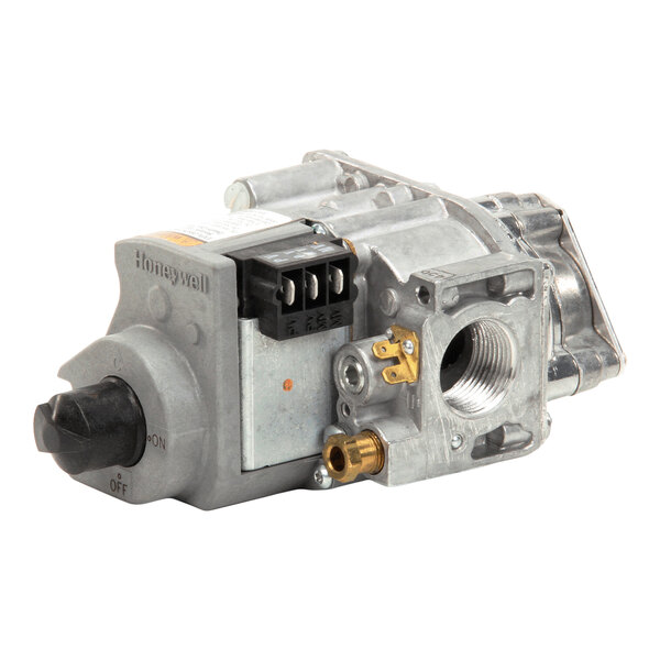 A metallic gas valve assembly with a control knob, electrical terminals, and threaded pipe connections.