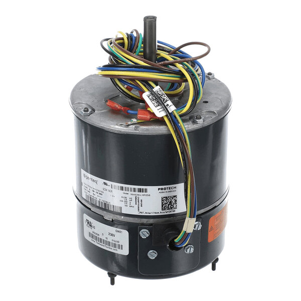 A cylindrical electric motor with a central shaft and multiple colored wires coiled on top, featuring several labels and barcodes on its body.