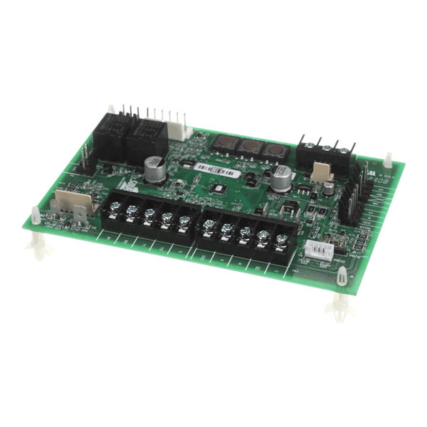 A green electronic circuit board with various components, including capacitors, relays, terminal blocks, and connectors, mounted on it.