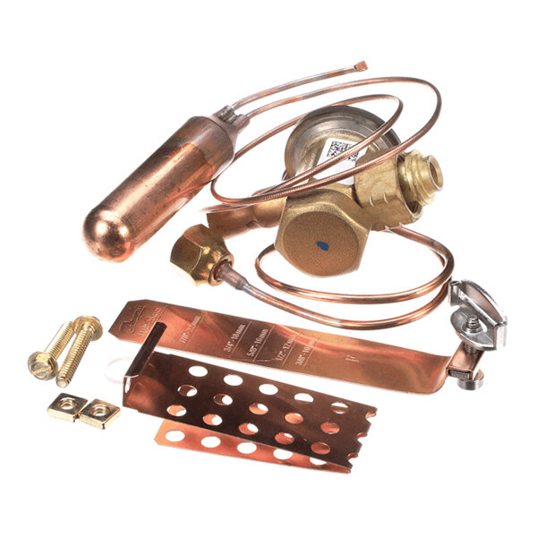 A collection of metal components including a valve, copper tubing, a cylindrical canister, and various mounting hardware pieces.
