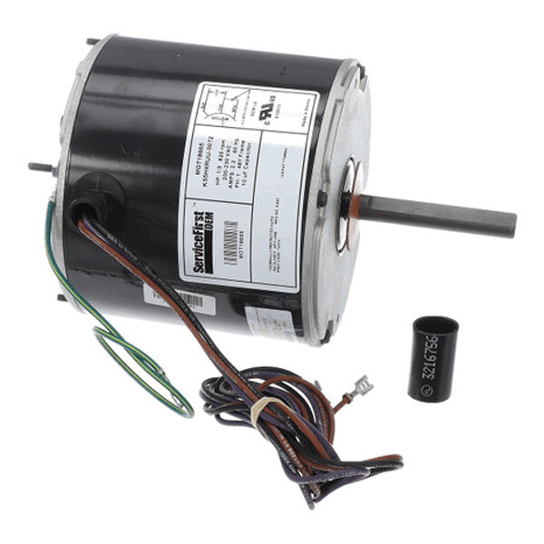 A cylindrical electric motor with attached wires and a capacitor, featuring a metal shaft protruding from one end and a label with technical specifications on the side.