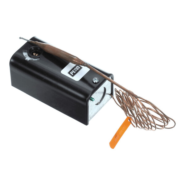 A black rectangular device with a coiled copper wire and an orange tag attached.
