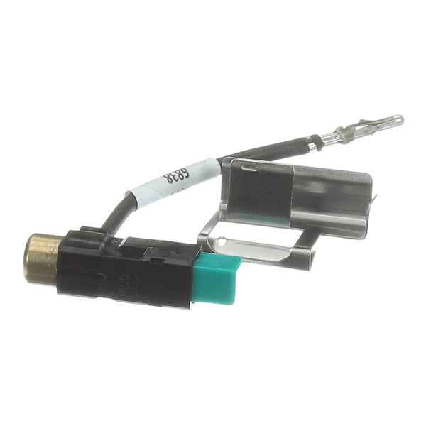 A small electronic component with a black and green plastic housing, a metal clip, and a wire with a terminal connector.