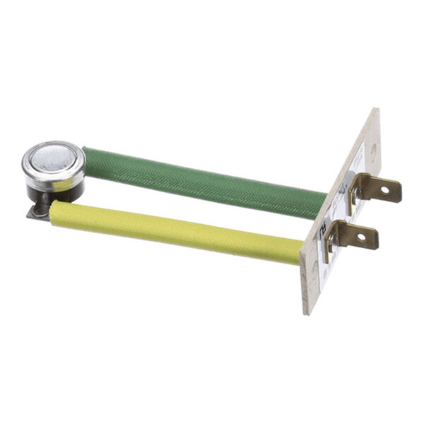 A metal component with two insulated wires (one green, one yellow) connected to a small round metallic device and a mounting plate with two electrical terminals.