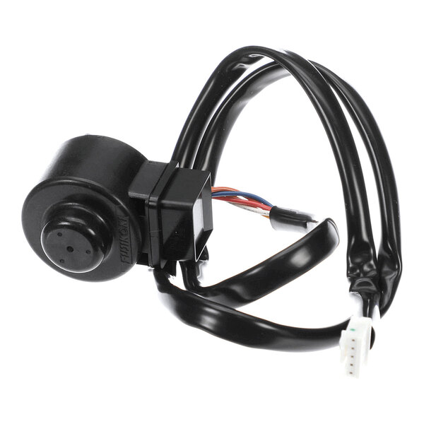 A black cylindrical electronic component with attached wiring and connectors.