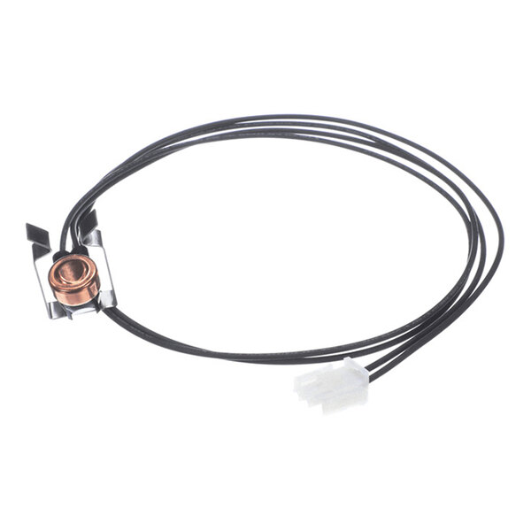A small electronic component with a copper-colored circular element, attached to black wires and a white connector, and mounted on a metal clip.