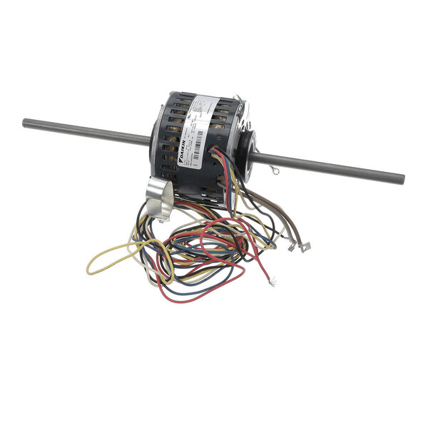 A cylindrical electric motor with two long metal shafts extending from either side and several multicolored wires attached.