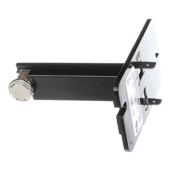 A black rectangular metal component with a round metallic end and a flat mounting plate featuring labels and slots.