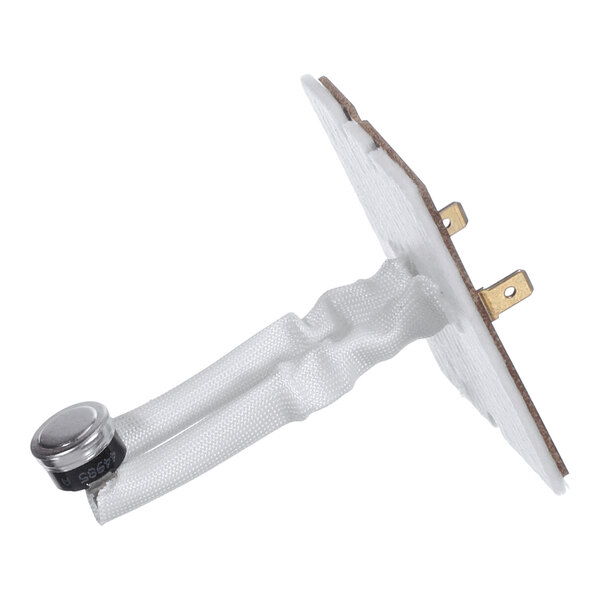 A close-up view of an electronic component with a metal sensor, fabric-like insulated wires, and a flat mounting plate with two brass terminals.