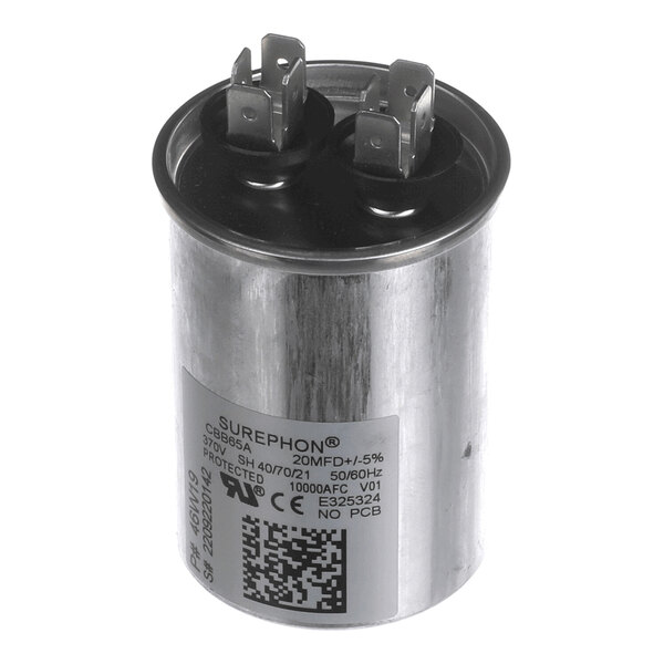 A cylindrical metallic capacitor with two pairs of electrical terminals on top and a label with technical specifications on the side.