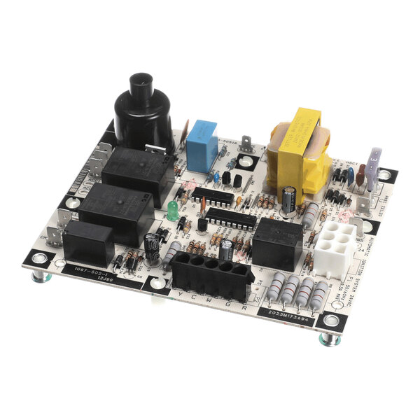 A rectangular electronic circuit board with various components including capacitors, resistors, relays, connectors, and a transformer mounted on it.