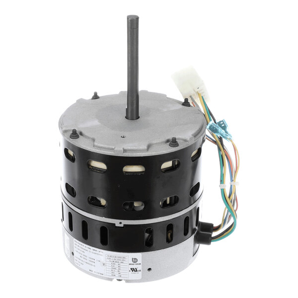 A cylindrical electric motor with a central shaft, multiple colored wires, and a white connector attached.