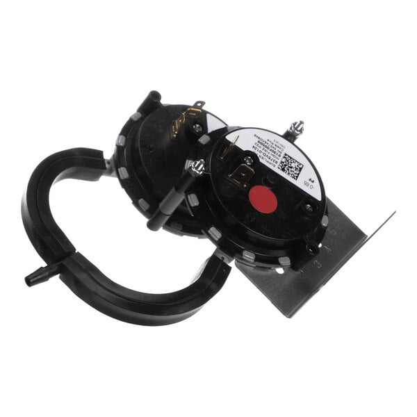A dual pressure switch assembly with two round black components mounted on a metal bracket, featuring electrical terminals and attached tubing.