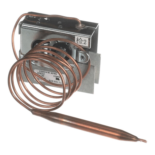 A metal temperature control switch with a coiled copper sensor tube attached.