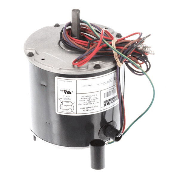 A cylindrical electric motor with a metal shaft, multiple colored wires, and a label on the side.