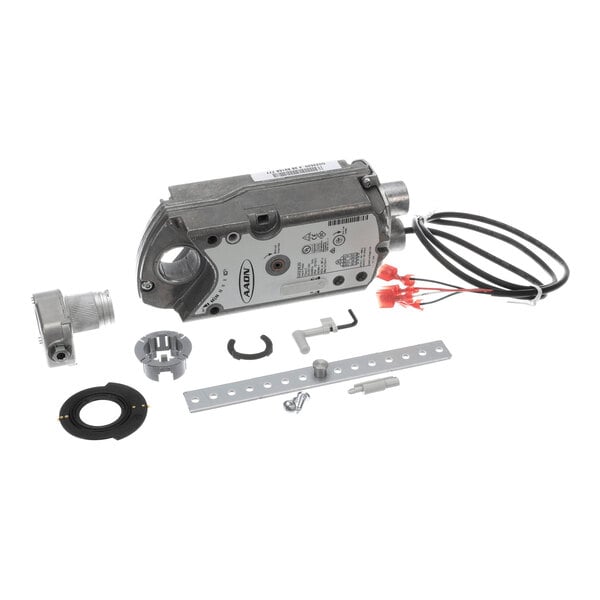 A metal actuator device with attached wires and various small metal and plastic mounting components arranged around it.