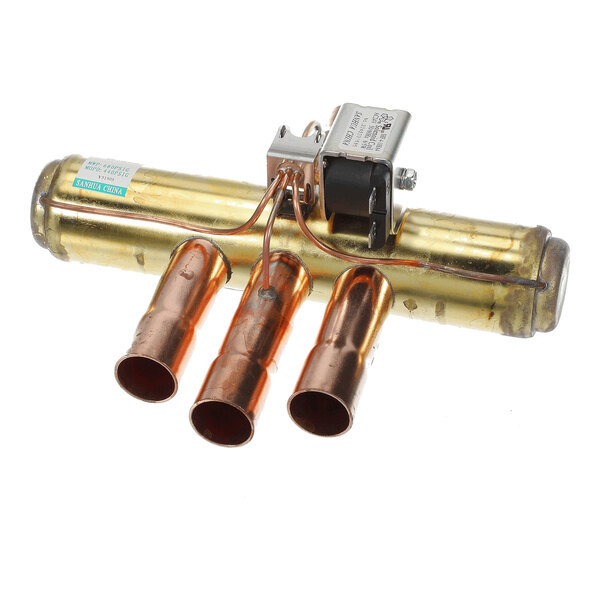 A metallic valve assembly with three copper pipe connections and an attached solenoid component.