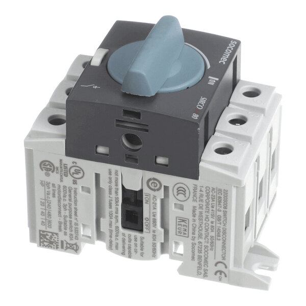 A gray and white rotary switch with a blue handle and labeled markings, featuring multiple connection points and technical information printed on the side.