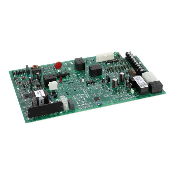 A green printed circuit board (PCB) with various electronic components such as capacitors, relays, connectors, and integrated circuits mounted on its surface.