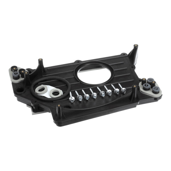 A black rectangular plastic component with multiple mounting points, two circular openings, and a row of screws placed on its surface.