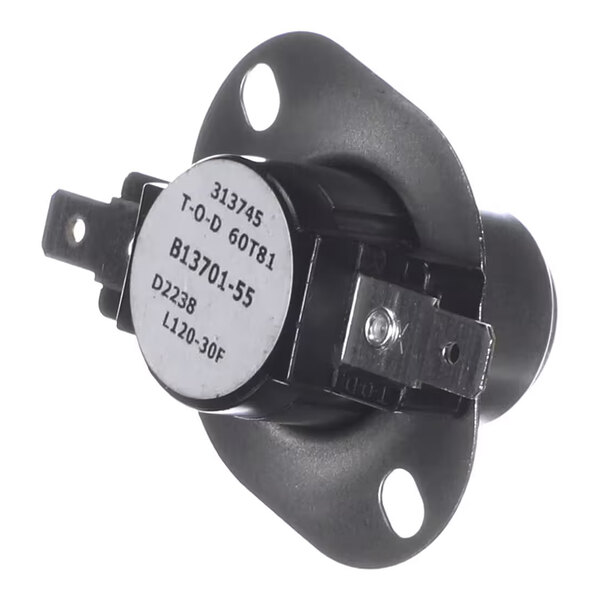A round, metal component with two mounting holes and two electrical terminals, featuring printed identification numbers and text on its face.