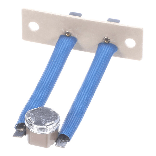 A small electronic component with two blue insulated wires attached to a metal mounting plate and a cylindrical metal-capped device at the end.