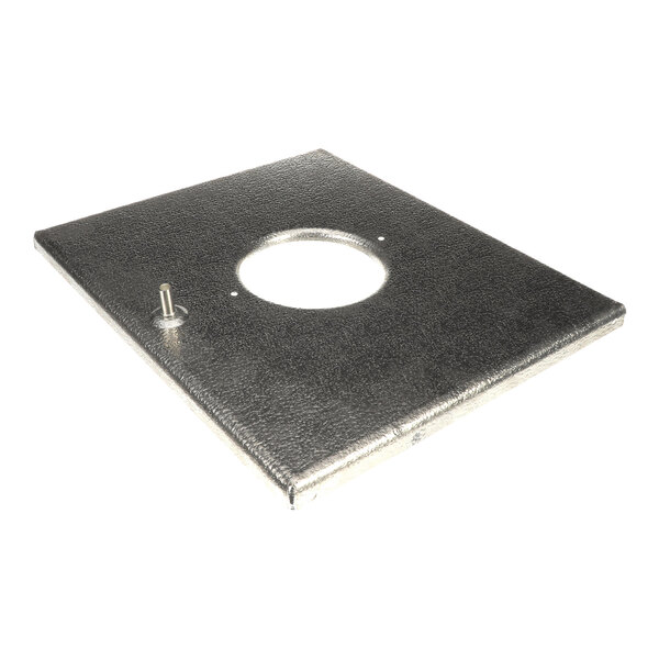 A rectangular metallic panel with a circular cutout in the center and a small protruding pipe on one side.