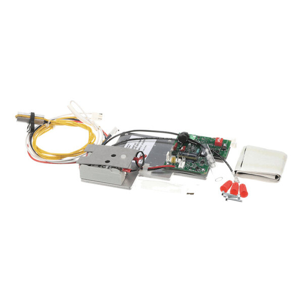 An assortment of electronic components and wires, including a circuit board, metal housing, yellow and red wires, and small hardware pieces, laid out on a white background.