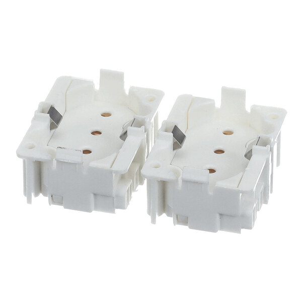 Two white plastic lamp sockets with multiple holes and metal contacts, shown side by side on a white background.