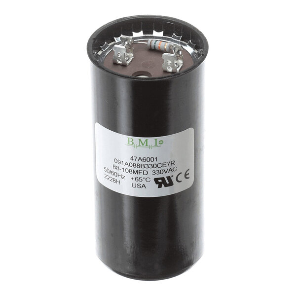A cylindrical black capacitor with metal terminals and a white label displaying technical specifications.