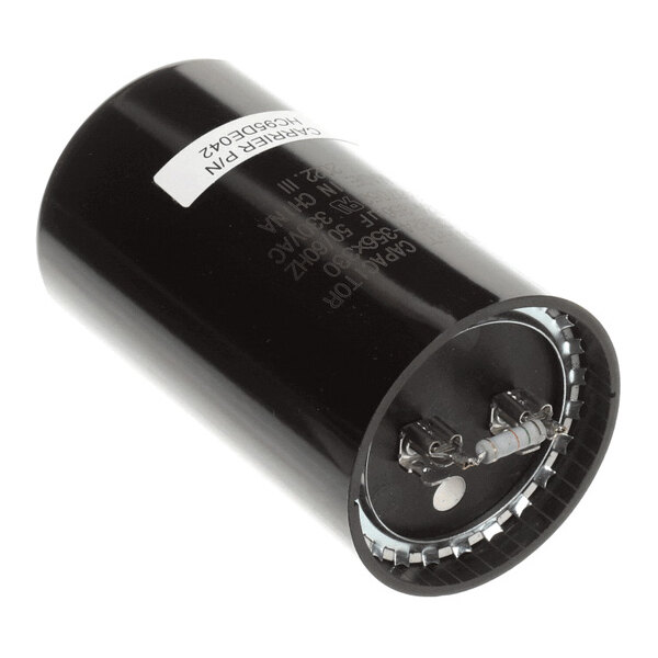 A cylindrical black electronic component with two metal terminals on one end, likely a capacitor.
