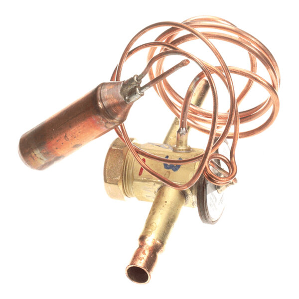 A brass and copper valve assembly with a coiled copper tube and a cylindrical component attached.