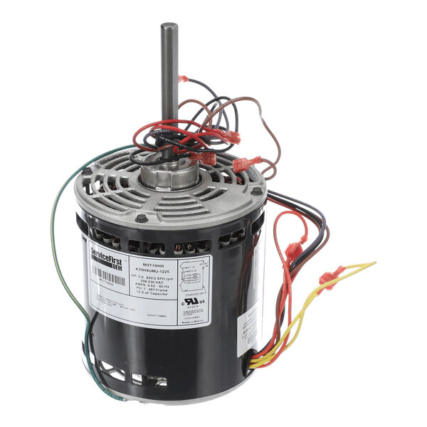 A cylindrical electric motor with a metal shaft, multiple colored wires, and a label on the side.
