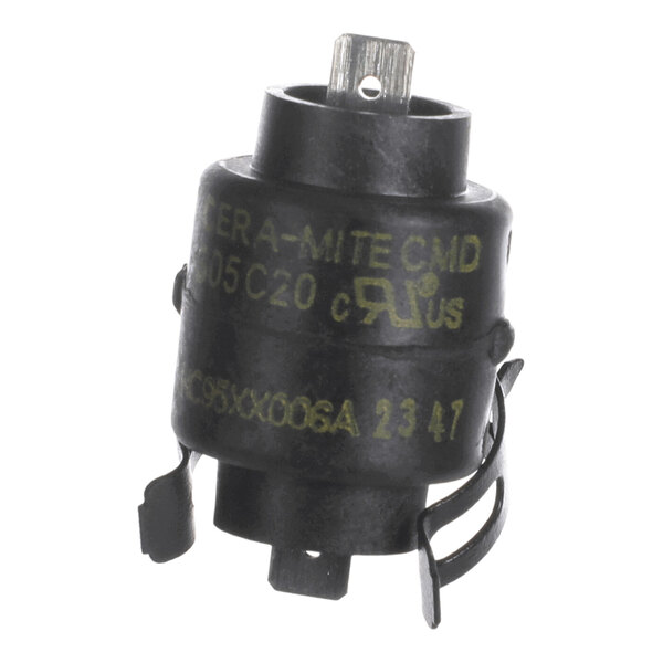 A small cylindrical black electronic component with metal terminals and yellow printed text.