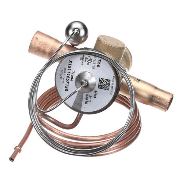 A metallic expansion valve with copper tubing and a coiled capillary tube attached.