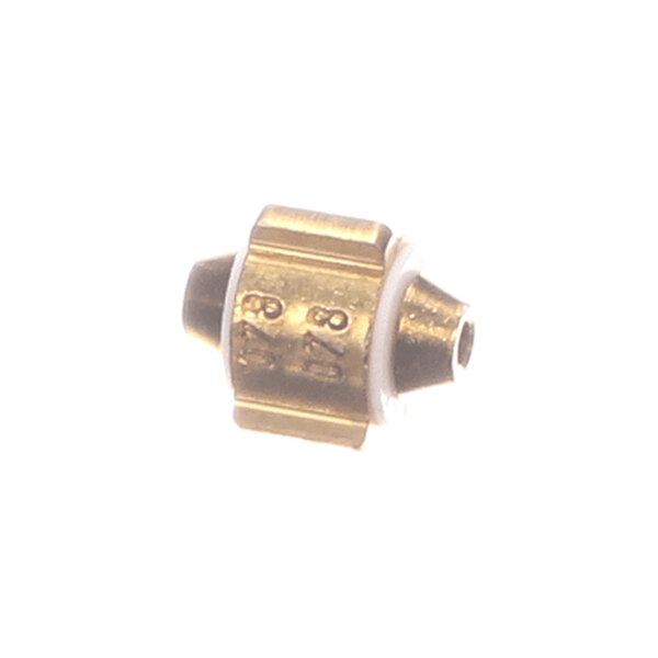 A small brass and metal component with a white ring, featuring engraved numbers on its surface.