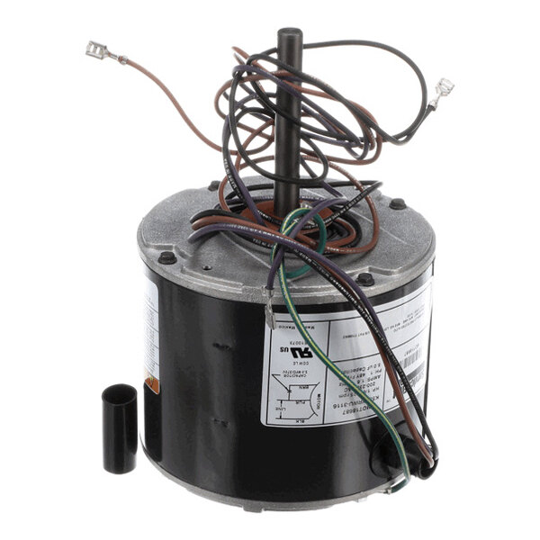 A cylindrical electric motor with a central shaft, several attached wires, and a label with technical specifications.