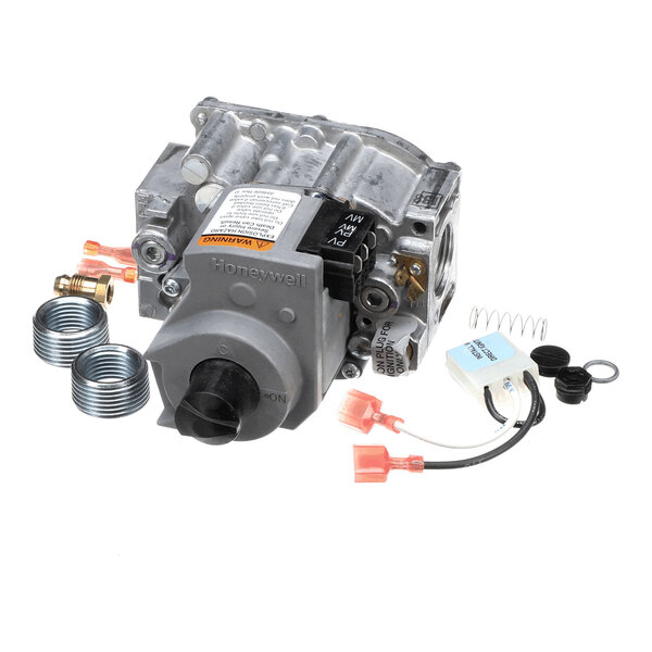 A metal gas valve assembly with attached wiring, springs, coils, and various small components arranged around it.