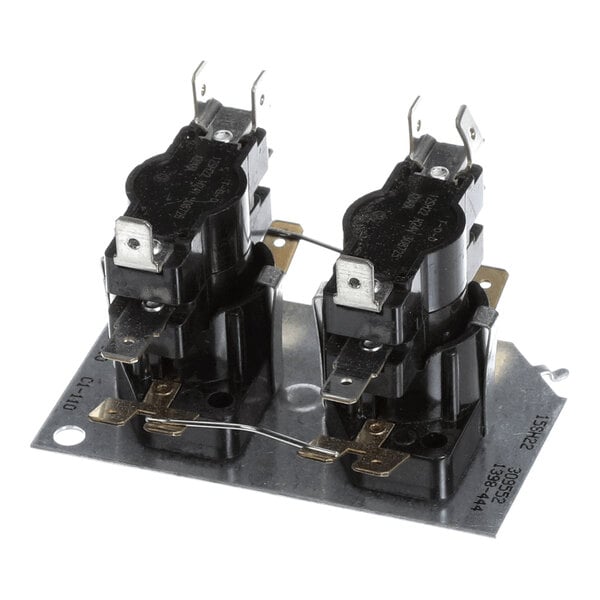 A metal mounting plate with two black electrical components, each featuring multiple metal terminals and connectors.