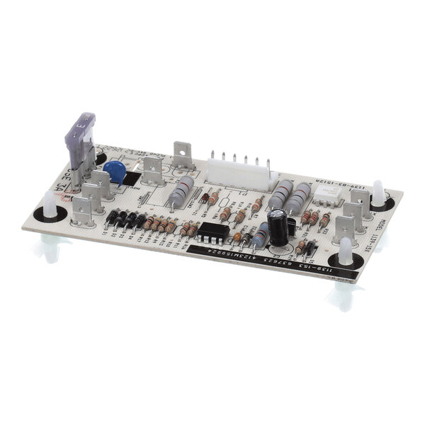 A rectangular electronic circuit board with various resistors, capacitors, connectors, and a fuse mounted on it.