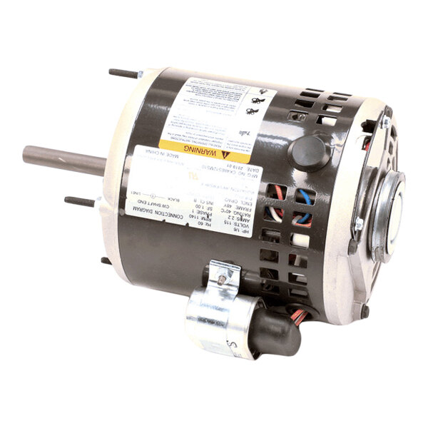 A cylindrical electric motor with a metal housing, visible wiring, and attached labels.