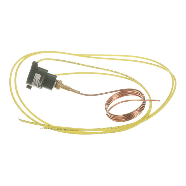 A device with a black cylindrical component, attached to a coiled copper tube and two long yellow wires.