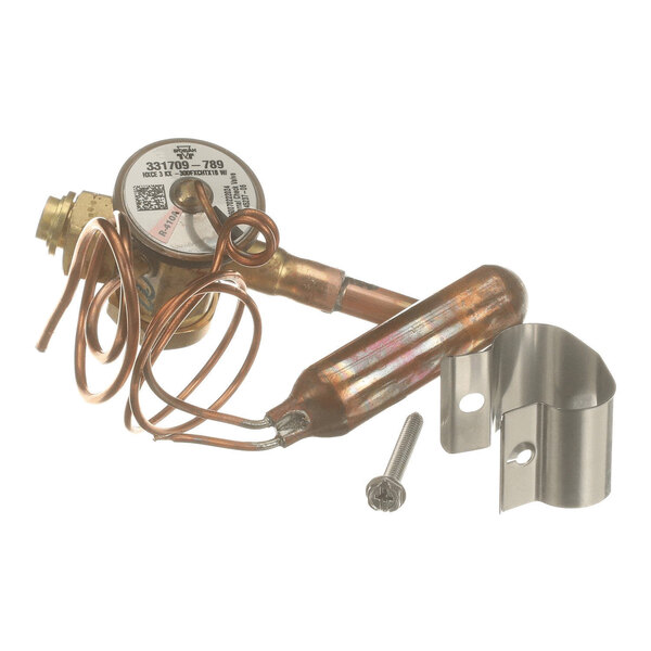 A metal valve assembly with coiled copper tubing, a cylindrical component, a screw, and a metal mounting bracket.