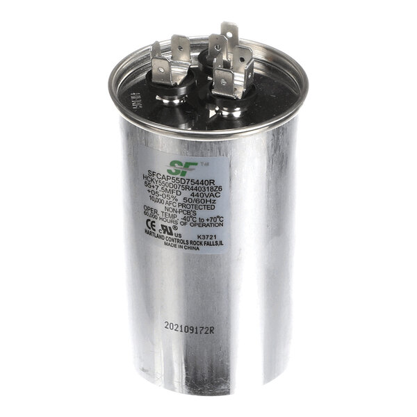 A cylindrical metal capacitor with two sets of electrical terminals on top and printed specifications on the side.