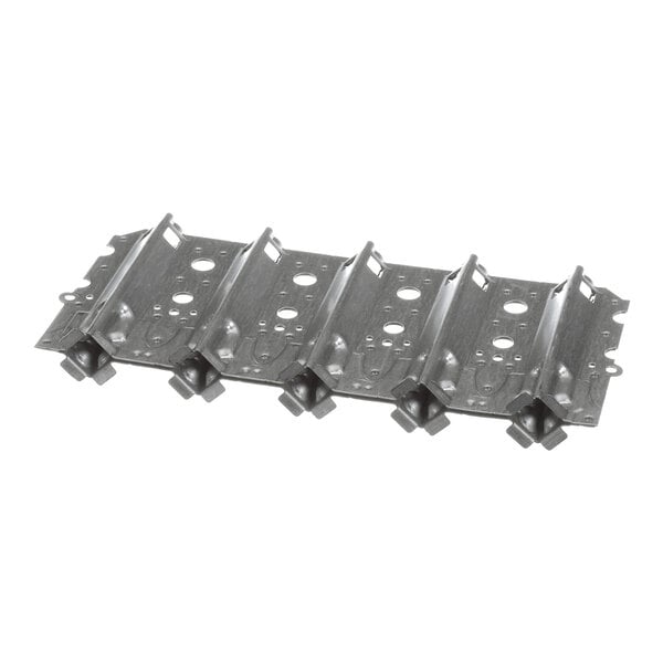 A metal component with five parallel sections, each featuring circular holes and raised ridges, likely part of a mechanical or heating assembly.